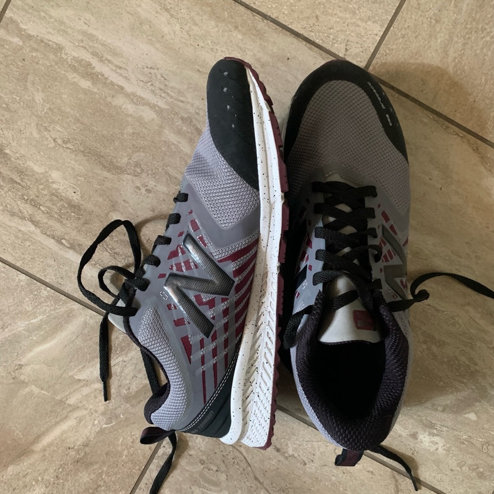New Balance gray and red running shoe.